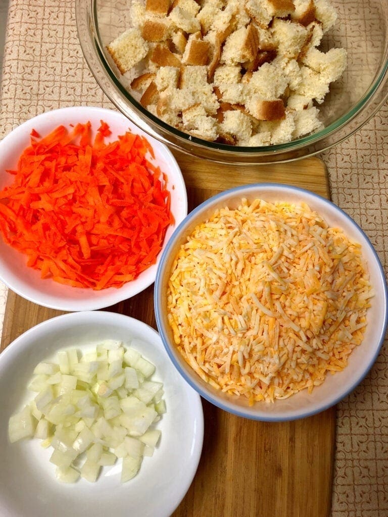 Meat Loaf Ingredients Bowls of Carrots cheese Onion Bread Cubes