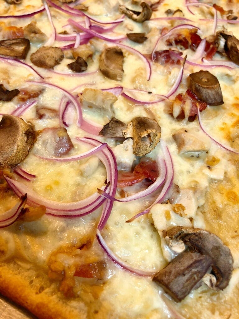 Close up of Pizza with Alfredo Sauce