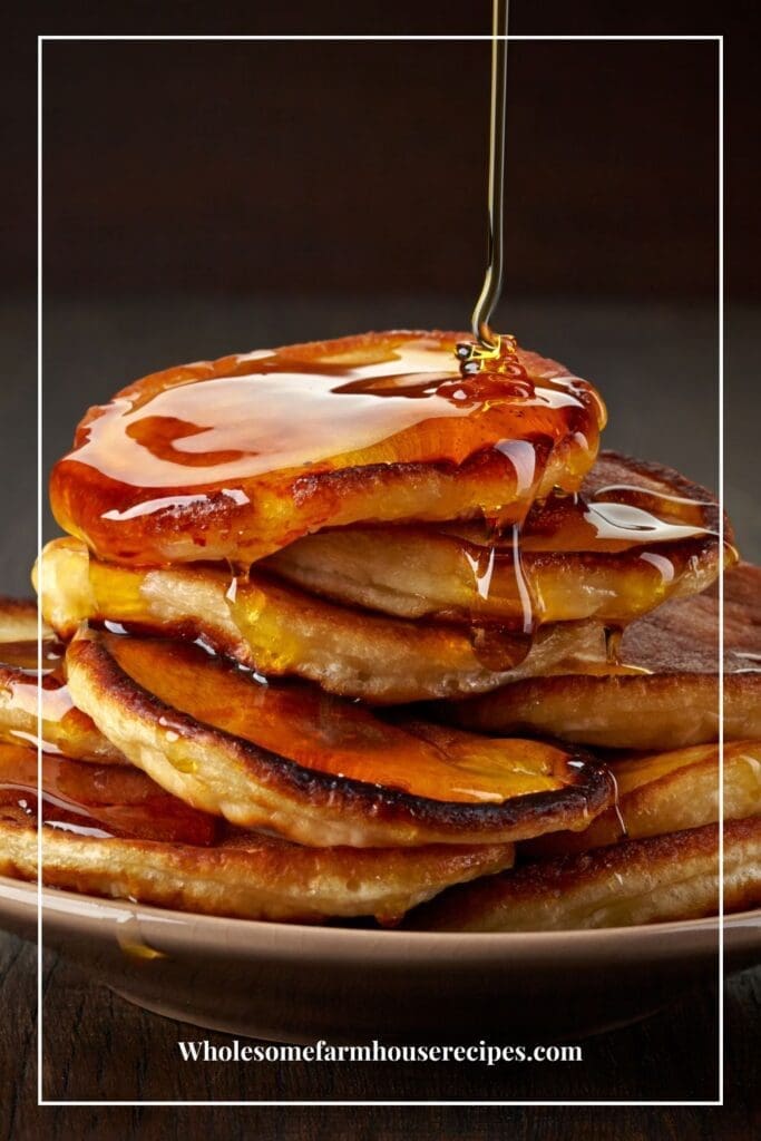 Pouring Syrup over Stack of Hotcakes