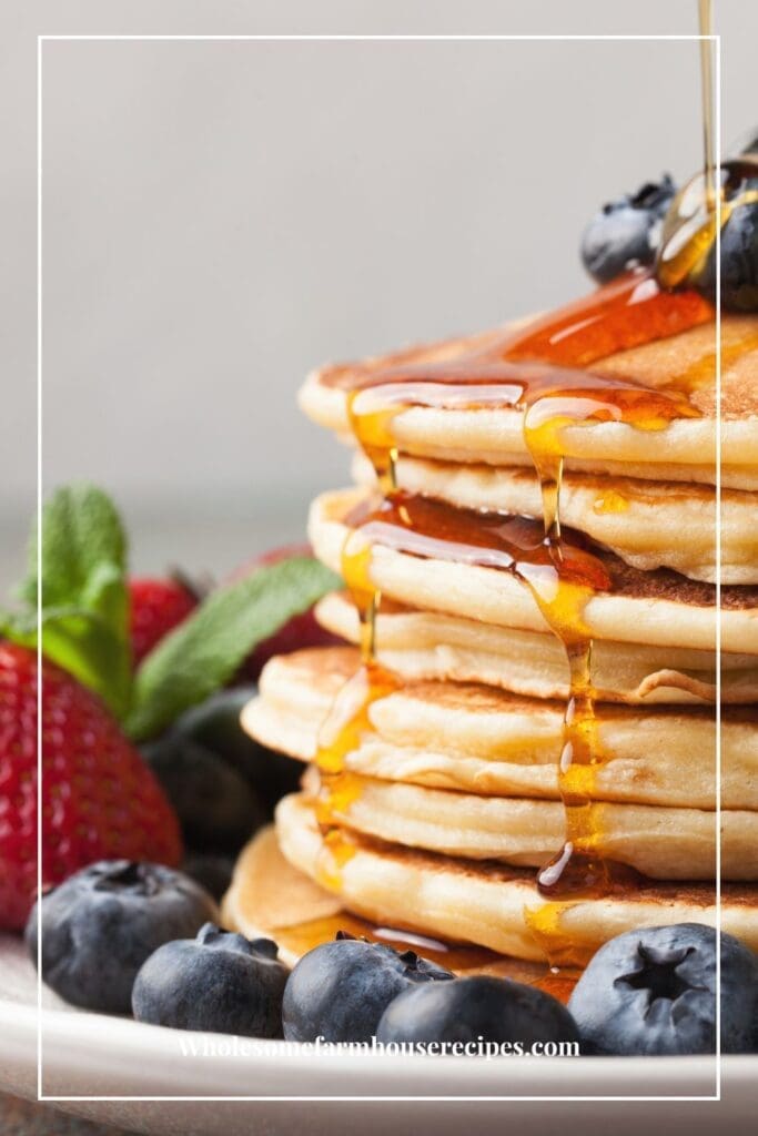 Stack of Pancakes with syrup and fresh fruit