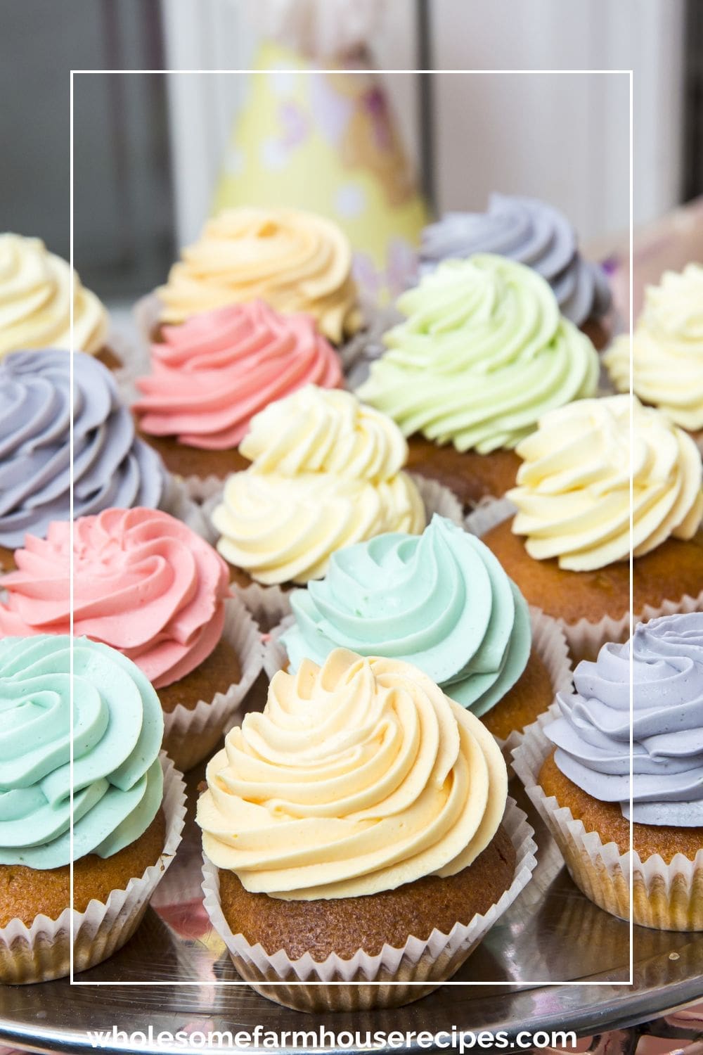 Multi colored icing on cup cakes