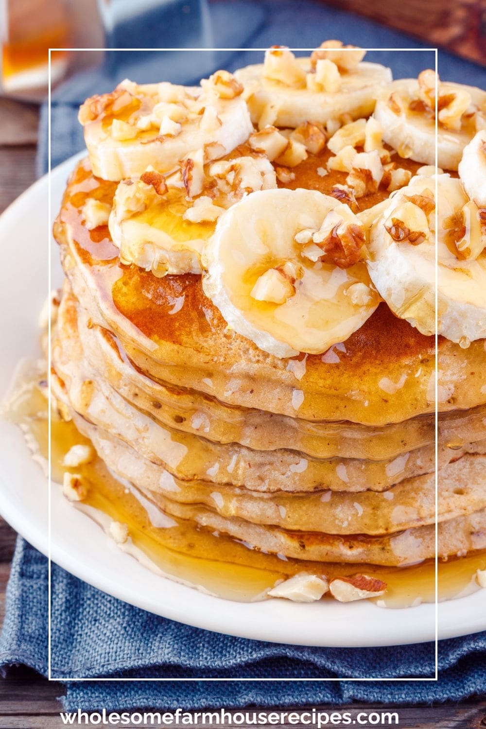 fluffy banana pancakes with walnuts, sliced bananas and maple syrup