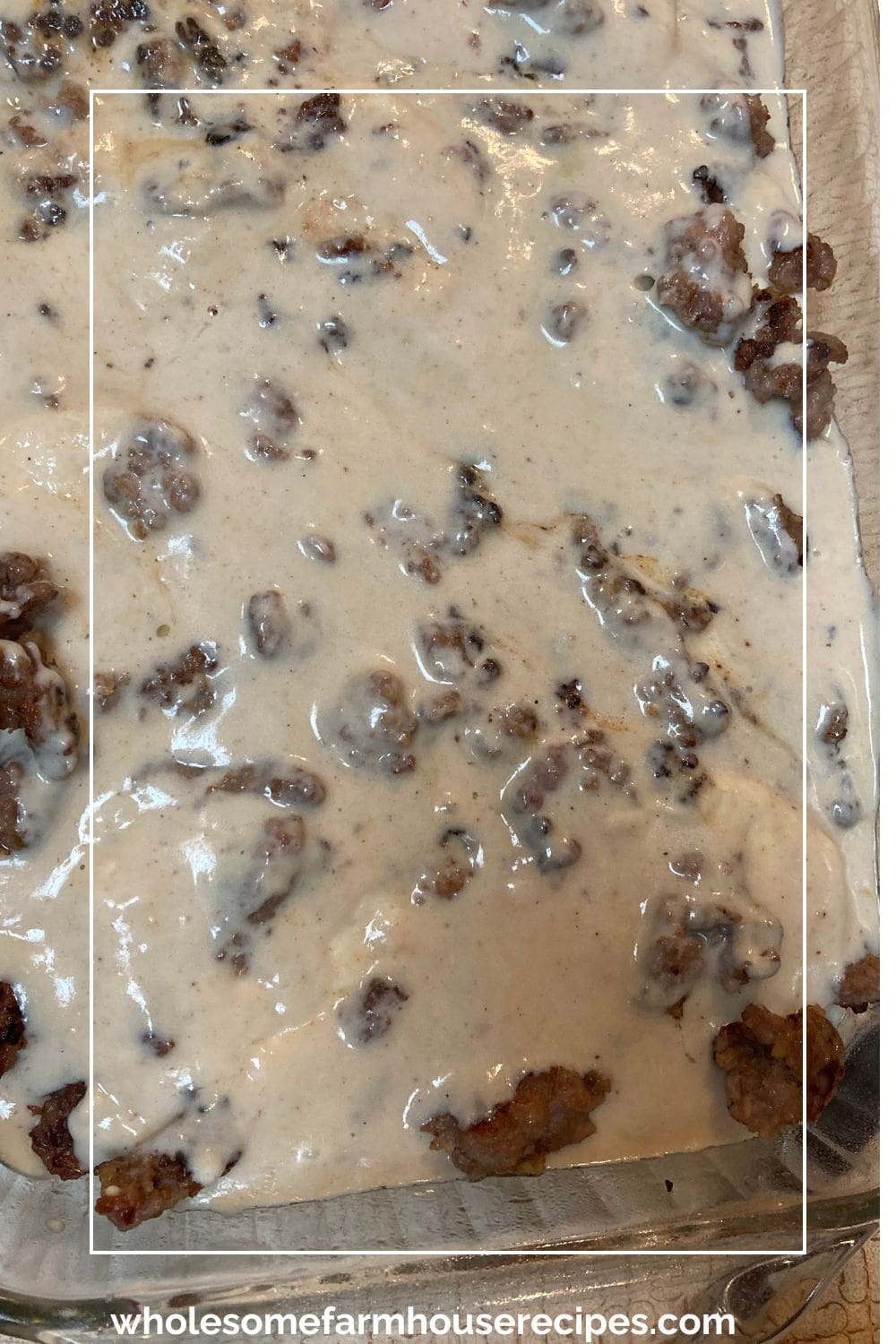 Assembling Sausage Gravy and Biscuit Bake