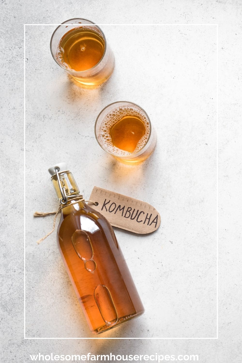 Bottle of Homemade Kombucha and two glasses of it