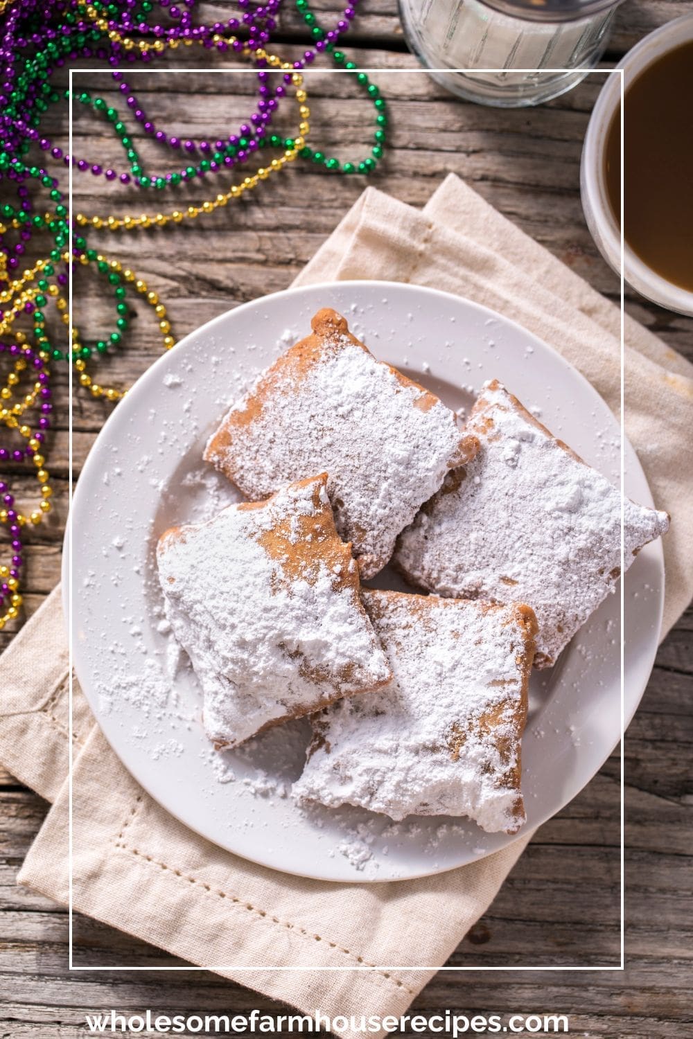 Plate of homemade choux beignets with powdered sugar