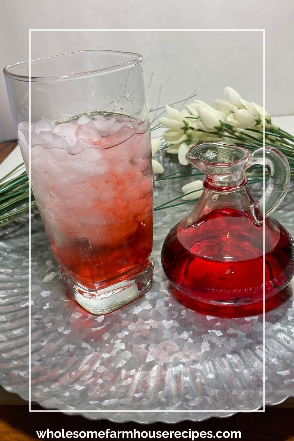 Adding Strawberry Syrup to a Glass of Water