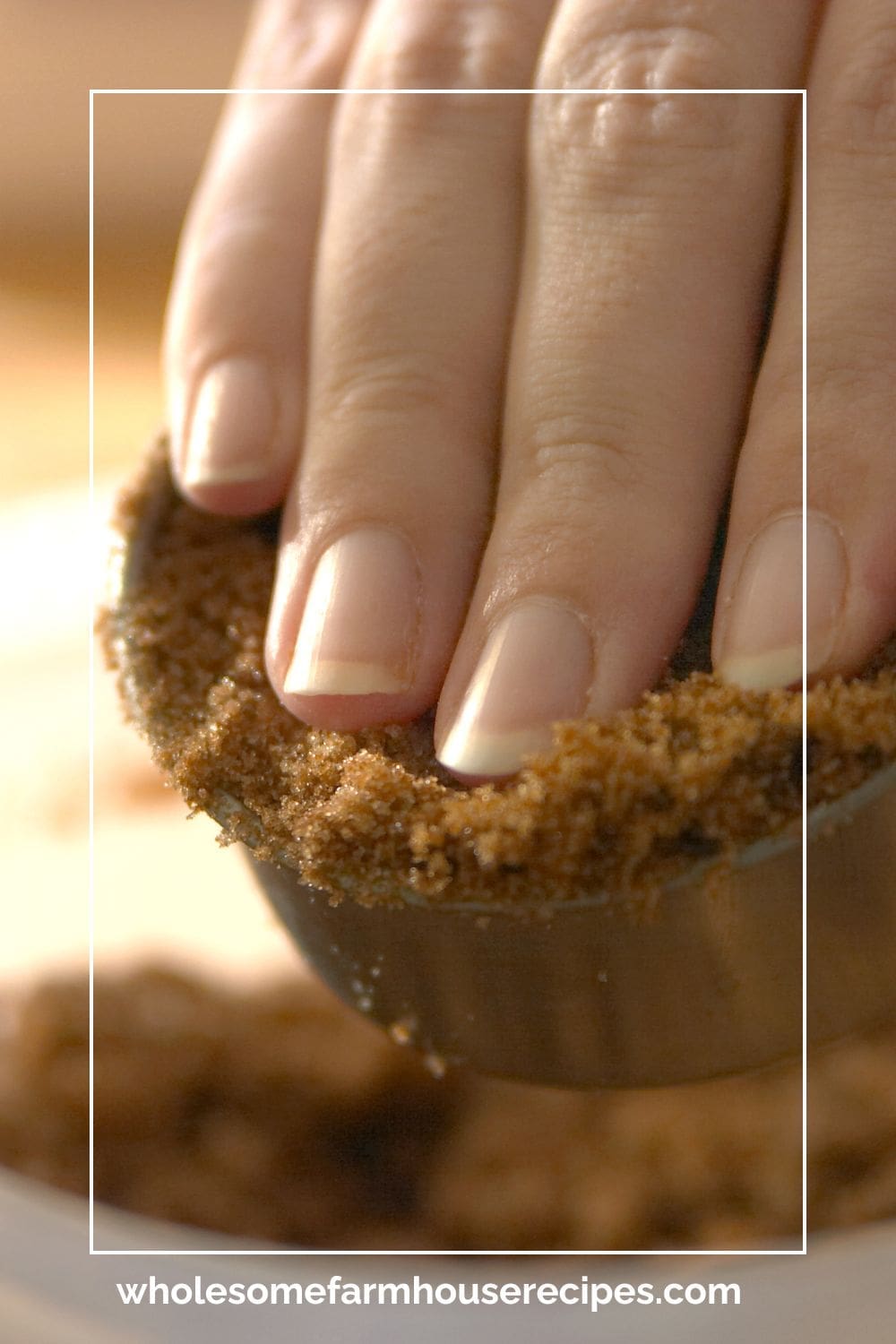 packing brown sugar in measuring cup