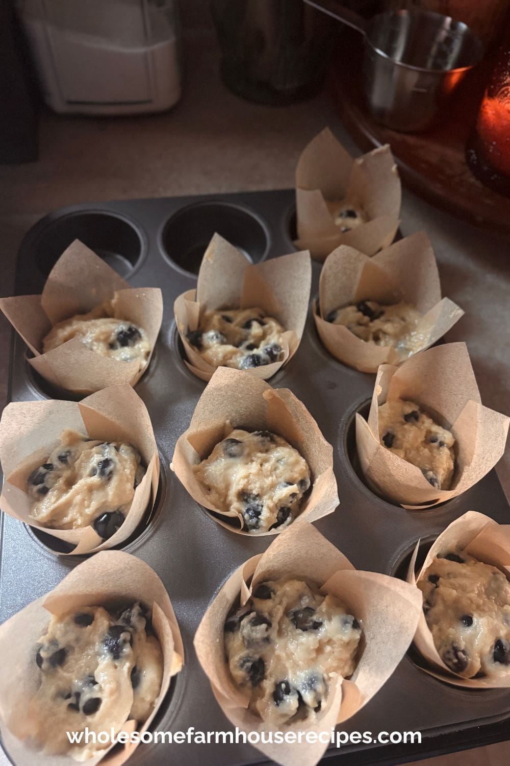 Adding the Blueberry Filling to the Muffin Tins